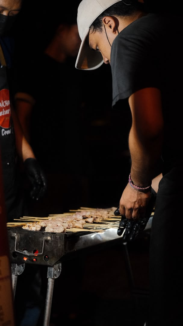 Taichan Jakarta crew working the grill at night